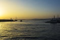 Fishermen and sailboat at sunset in Alimos marina in Athens, Greece Royalty Free Stock Photo