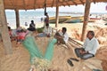 Fishermen Sewing Net at Rushikonda beach in Vishakhpatnam Royalty Free Stock Photo