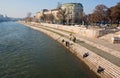 Fishermen sit on the bank of river