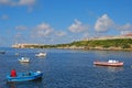 Fishermen in small boats with Morro Castle on the left and Fort of Saint Charles on the right in the background Royalty Free Stock Photo