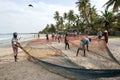 Fishermen spread out their nets on Uppuveli beach in Sri Lanka after a hard days work.