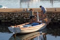 Fishermen stack the net after fishing on an old fishing boat at the pier in Simuni, island of Pag, Croatia Royalty Free Stock Photo