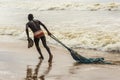 Fishermen taking the big net to the colony