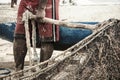 Fishermen taking the big net to the colony