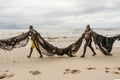 Fishermen taking the big net to the colony