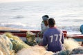 Fishermen Taking out fish from their gill net in Tamil Nadu, India