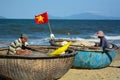 Fishermen on their traditional round boats (tung chai). An Bang beach. Hoi An. Vietnam