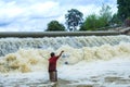 Fishermen, throw a net,Fishermen throw a net on the rubber dam . Royalty Free Stock Photo