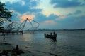 Fishermen are throwing Chinese nets in Fort Kochi.