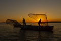 Fishermen throwing fishing net into the sea Royalty Free Stock Photo