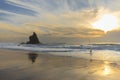 Fisherman in adraga beach at sunset Royalty Free Stock Photo