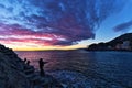 Fishermen under a beautiful sky after sunset, Italy