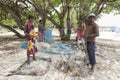 Fishermen and women preparing their fishing nets on Delft Island in the northern region of Jaffna in Sri Lanka.