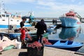 Fishermen work in the old town of Taranto, Puglia, Italy