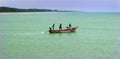 Fishermen at work on the wooden motor boat. Royalty Free Stock Photo