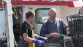 Fishermen Wrasse fishing pots on Fishing boat in Carnlough Antrim Northern Ireland 14-07-21