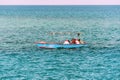 Fishermen on a yellow boat sail into the sea Royalty Free Stock Photo