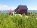 Fishermens wooden red cabins in harbor