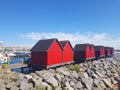 Fishermens wooden red cabins in harbor