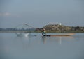 Fisherwoman in Lake with Traditional Fishing Net