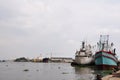 Fishery boat ship and General cargo vessel floating in water waiting catch fish marine life in ocean at fishing village of Royalty Free Stock Photo