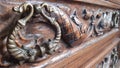 Fishes - ornament and handle of the antique wooden furniture drawer chest Royalty Free Stock Photo
