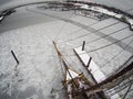 Fisheye aerial view from aloft on tallship in ice
