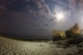 Fisheye - Night seascape with the moon and moving clouds