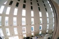 Fisheye shot of atrium of office with tall pillars and a huge open space