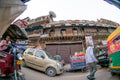 fisheye shot of chandni chowk with auto and electric rickshaw and old buildings