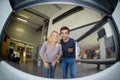 Fisheye view couple from inside woodburner Royalty Free Stock Photo