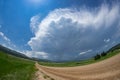 Fisheye view of a road leading to a severe warned thunderstorm over the Black Hills in South Dakota Royalty Free Stock Photo