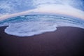 Fisheye view of sea waves, sunset Royalty Free Stock Photo