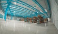 Fisheye view of a warehouse with pallets and goods