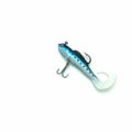 Fishing accessories. The bait is a blue silicone fish with two hooks Royalty Free Stock Photo