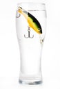 Fishing bait wobbler in glass with water Royalty Free Stock Photo