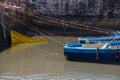 Fishing beautiful blue boats, gear and catch on background of Castelo Real of Mogador in Essaouira old harbor