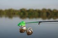 Fishing bell at the end of a fishing rod. Bells will ring when the fish is hooked Royalty Free Stock Photo