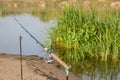 Fishing bell at the end of a fishing rod. Bells will ring when the fish is hooked Royalty Free Stock Photo