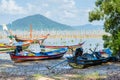 Wood Fishing Boat is Parking on the Beach.