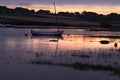 Fishing boat at anchor in Alnmouth at sunset Royalty Free Stock Photo