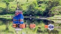 Fishing boat anchored in the middle of Clifden Bay at high tide