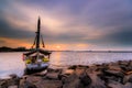 a fishing boat on Ancol beach, Jakarta, is anchored while enjoying the beautiful sunset Royalty Free Stock Photo