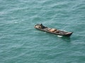 Fishing boat in asia on calm blue sea from above