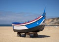 Fishing boat in a beach exhibit by the Dr. Joaquim Manso Museum in collaboration with the municipality of Nazare, Portugal.