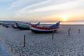 Fishing boat on the beach at sunset