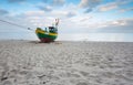 Fishing boat on the beach. Tranquil evening landscape. Royalty Free Stock Photo