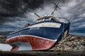 Whiteway Newfoundland Canada, September 25 2022: Fishing boat beached as a storm rolls in across the Atlantic Ocean