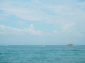 Fishing boat in blue sea with clouds sky background in Thailand. Relaxing moments in summer seasons travel. Royalty Free Stock Photo