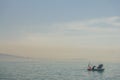 Fishing boat on the Bosporus, surrounded by seagulls in Turkey